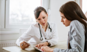 The doctor makes a rundown of possible medication for the woman.